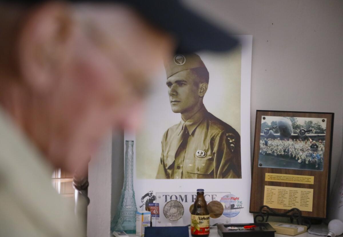 Tom Rice in the foreground, with a photo board of him in the background