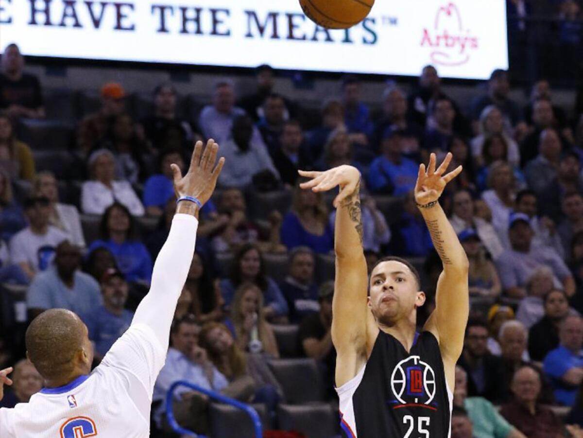 Clippers guard Austin Rivers (25) shoots over Thunder guard Randy Foye during the first quarter of a game on March 31.