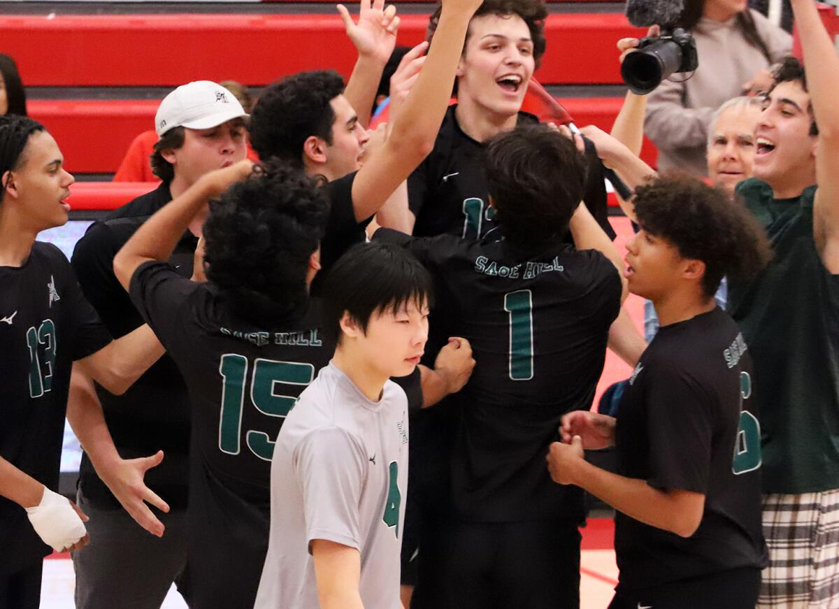 The Sage Hill boys' volleyball team, seen celebrating a win against Fullerton on April 25.