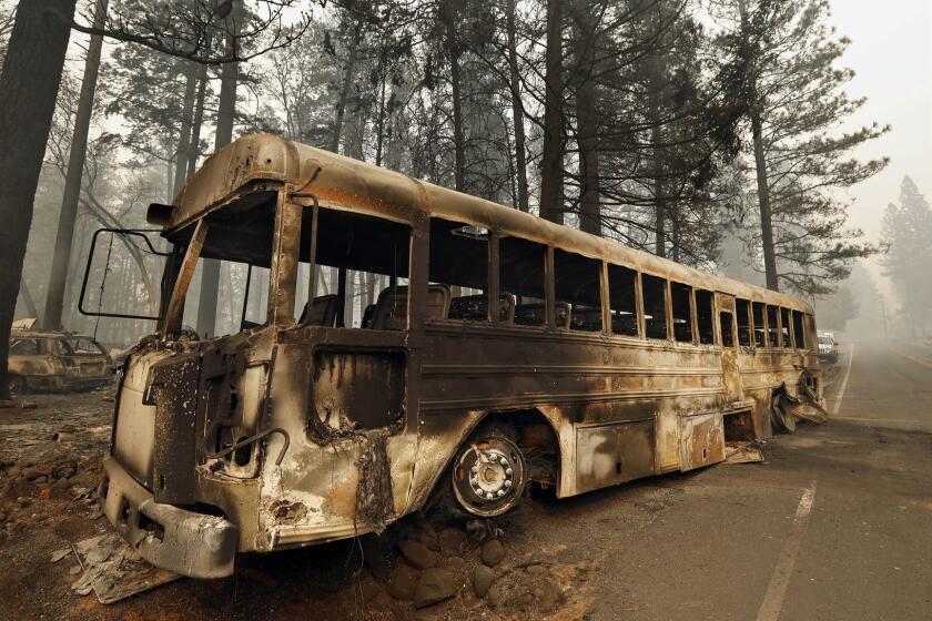 PARADISE, CALIFORNIA--NOV. 11, 2018-The bus that many people had to abandon in order to make it out of the Camp fire, on Skyway in Paradise, CA. (Carolyn Cole/Los Angeles Times)