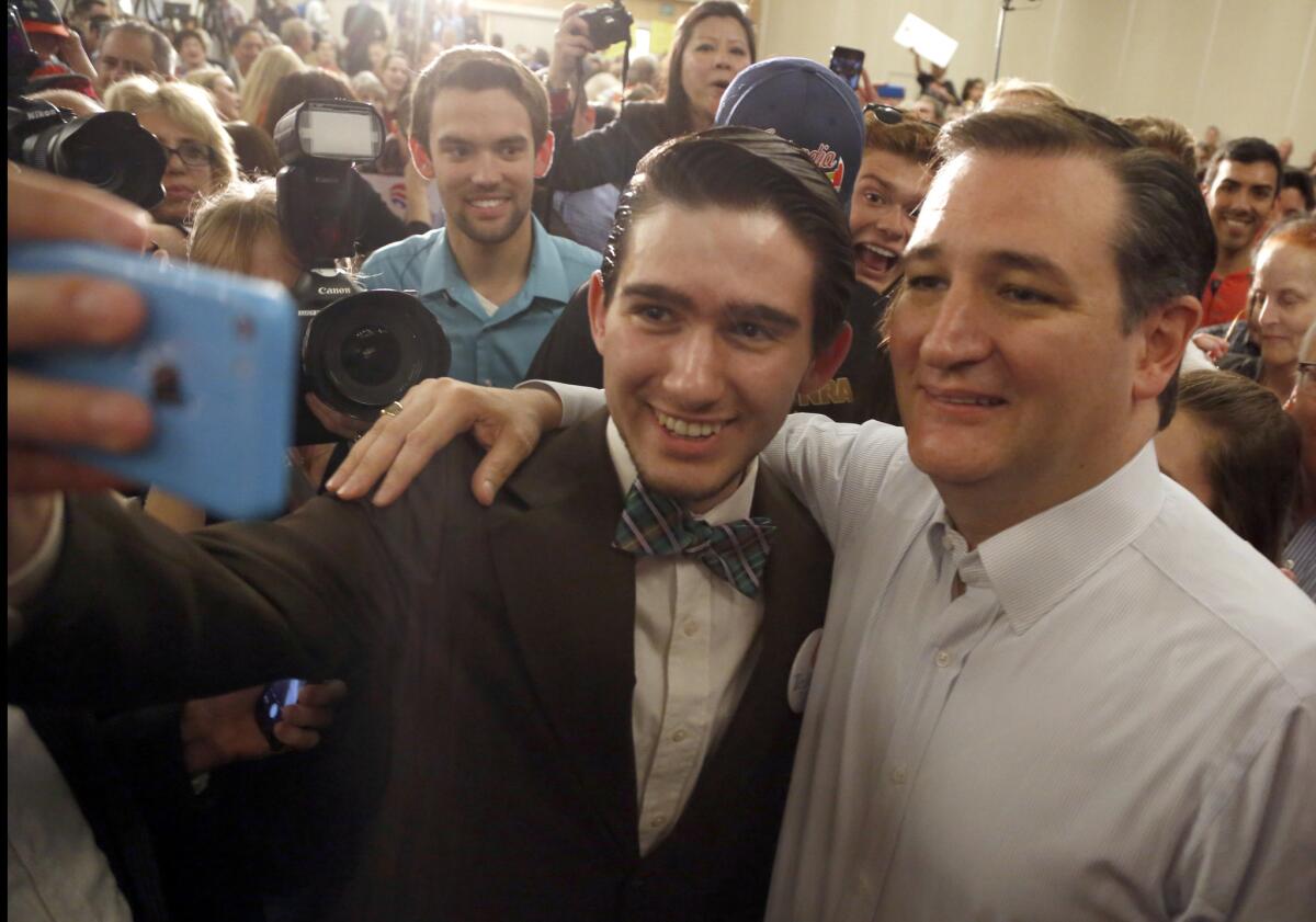Cruz poses for pictures with supporters.