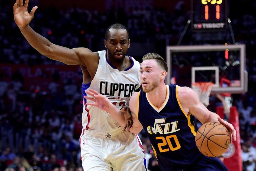 LOS ANGELES, CA - APRIL 15: Gordon Hayward #20 of the Utah Jazz drives to the basket ahead of Luc Mbah a Moute #12 of the LA Clippers during a 97-95 Jazz win at Staples Center on April 15, 2017 in Los Angeles, California. NOTE TO USER: User expressly acknowledges and agrees that, by downloading and or using this photograph, User is consenting to the terms and conditions of the Getty Images License Agreement. (Photo by Harry How/Getty Images) ** OUTS - ELSENT, FPG, CM - OUTS * NM, PH, VA if sourced by CT, LA or MoD **