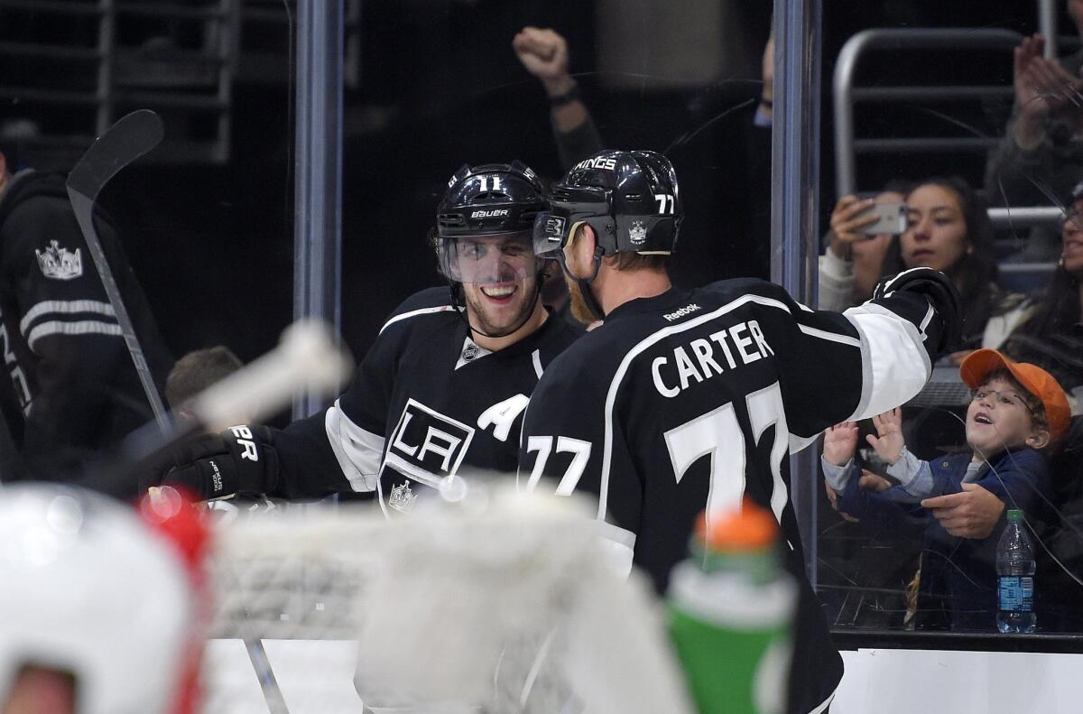 Anze Kopitar, left, celebrates his second-period goal with teammate Jeff Carter during the Kings' game Saturday against San Jose at Staples Center.