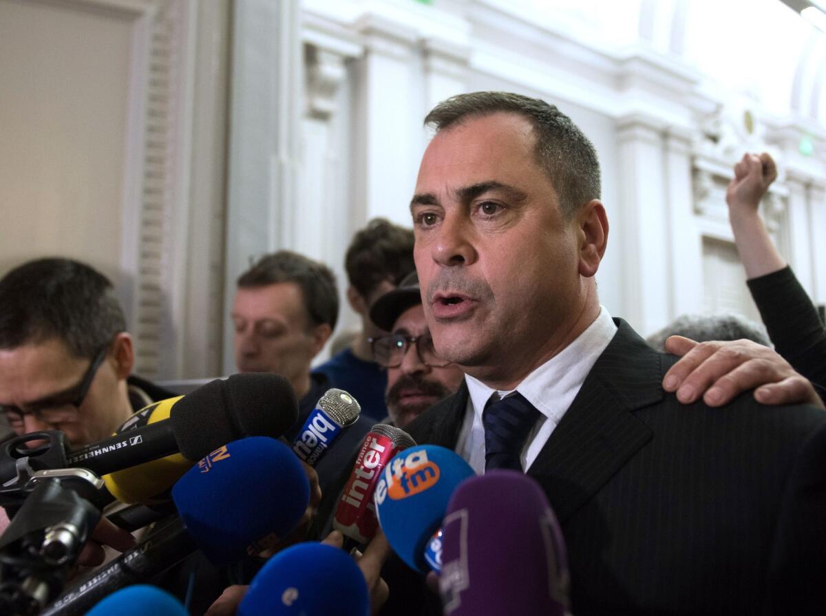 Robert Lawrie speaks to journalists as he leaves the courtroom after his trial in Boulogne-sur-Mer, France.