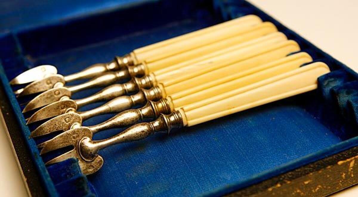 Antique ivory-handled oyster forks are from a flea market in Paris.