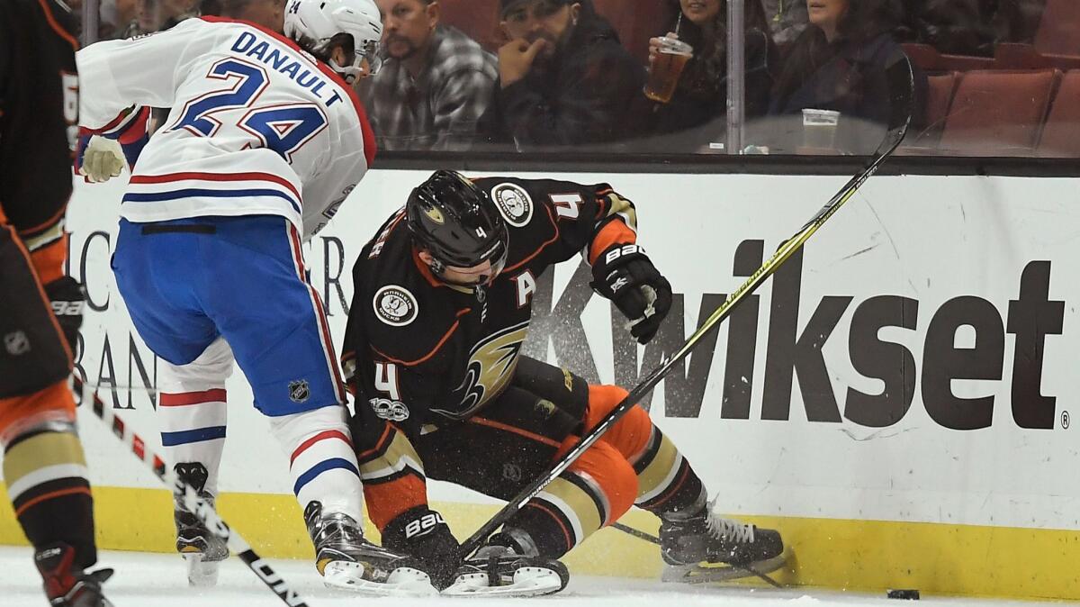 Ducks defenseman Cam Fowler, right, was injured when a stick got caught in his skate during a game against the Montreal Canadiens on Oct. 20.
