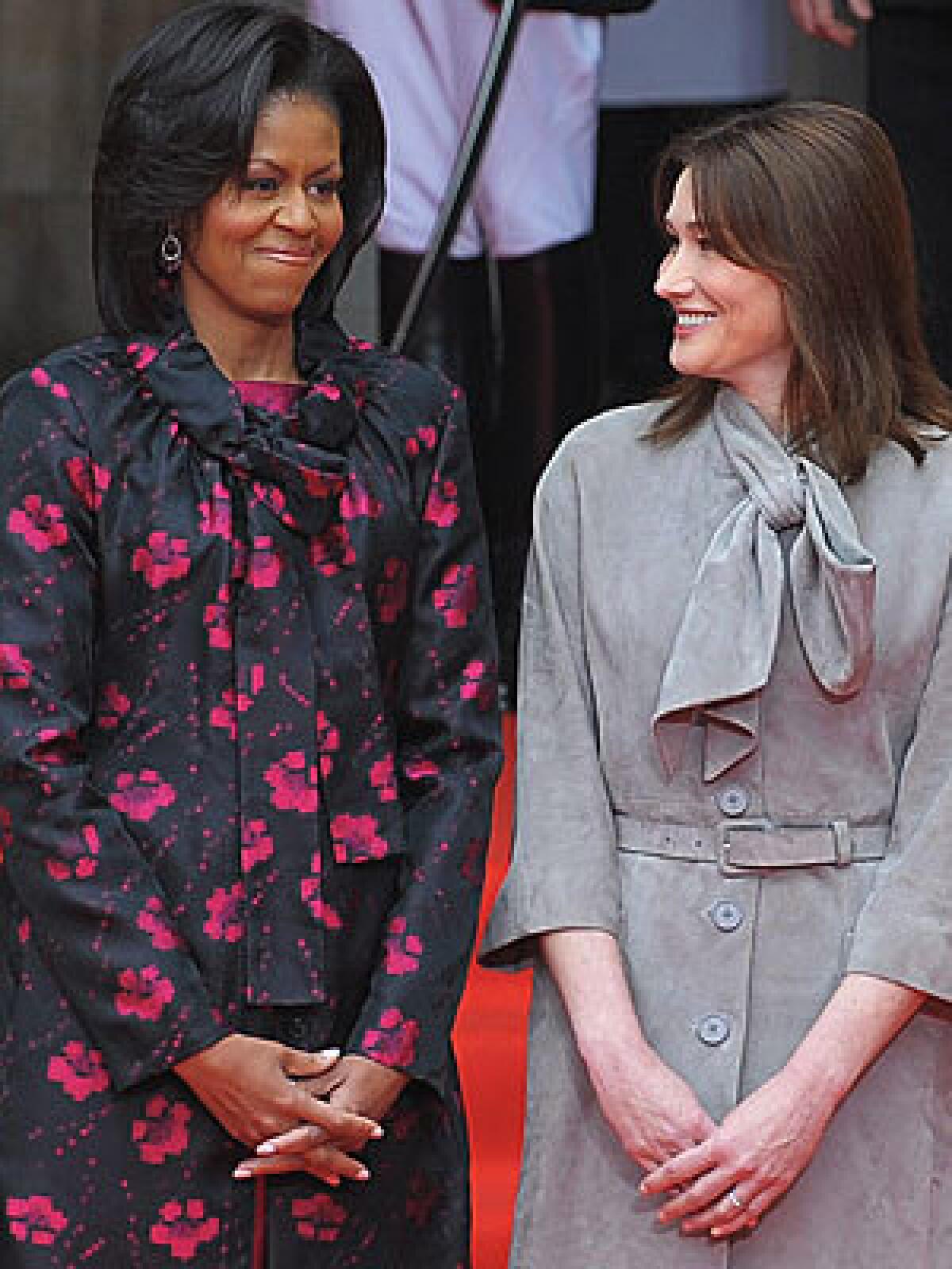FIRST LADIES: Michelle Obama, Carla Bruni-Sarkozy.
