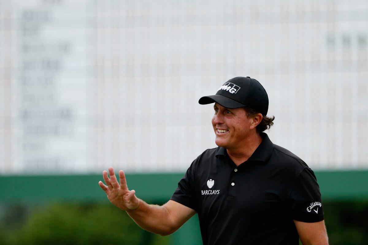 Phil Mickelson smiles after shooting a final-round 69 at the 2015 Masters Tournament at Augusta National Golf Club.