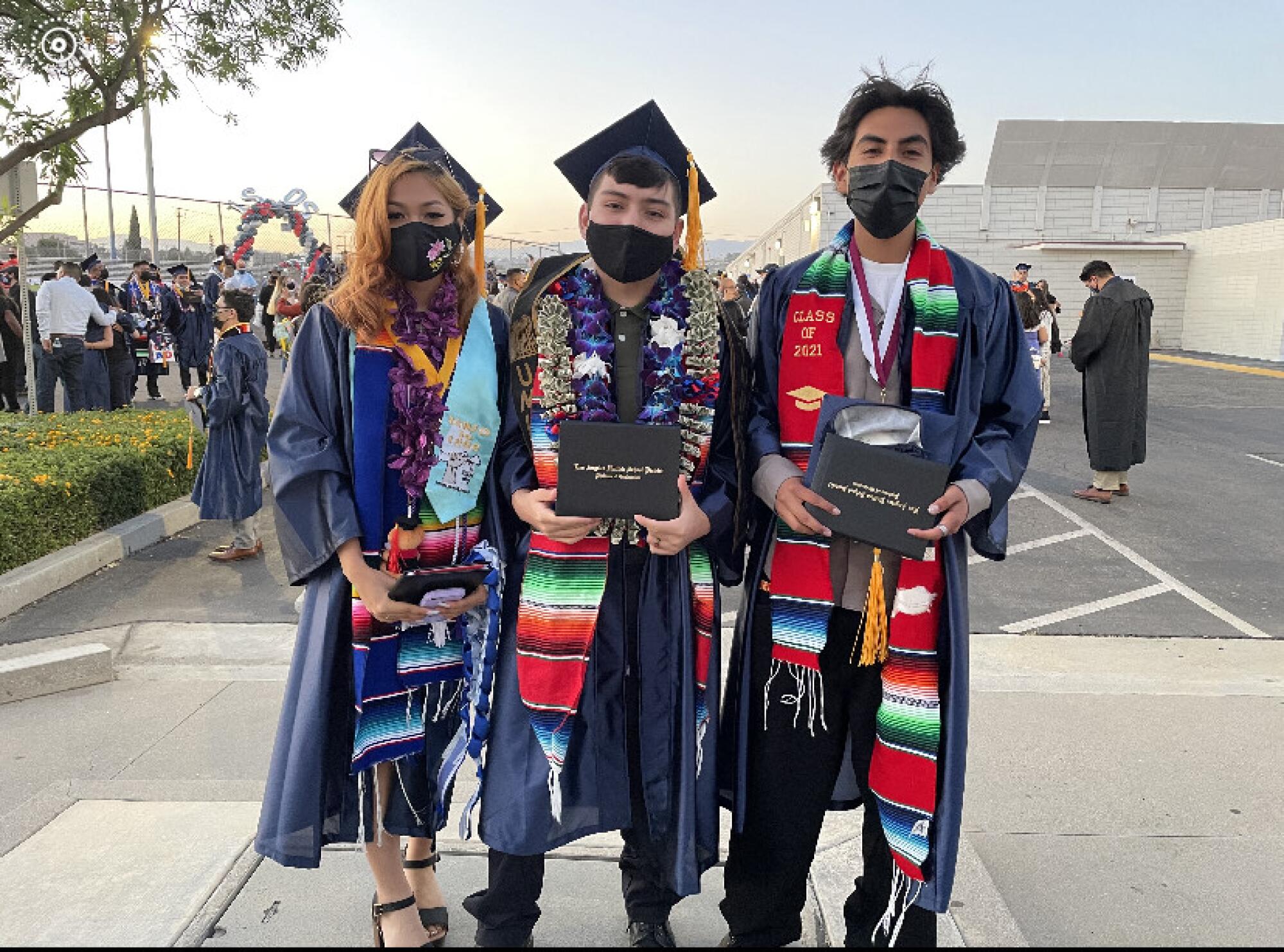 Joaquin Gonzalez, center, with his friends on graduation day at Garfield Senior High School.