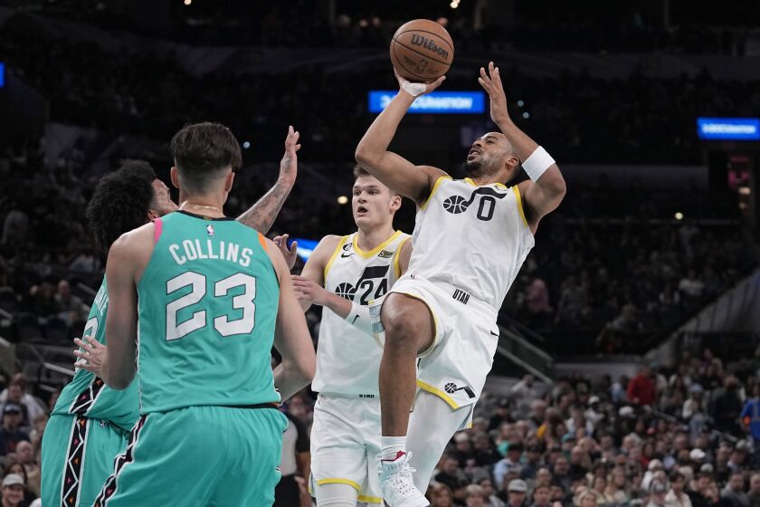 Utah Jazz guard Talen Horton-Tucker (0) shoots against the San Antonio Spurs during the second half of an NBA basketball game in San Antonio, Wednesday, March 29, 2023. (AP Photo/Eric Gay)