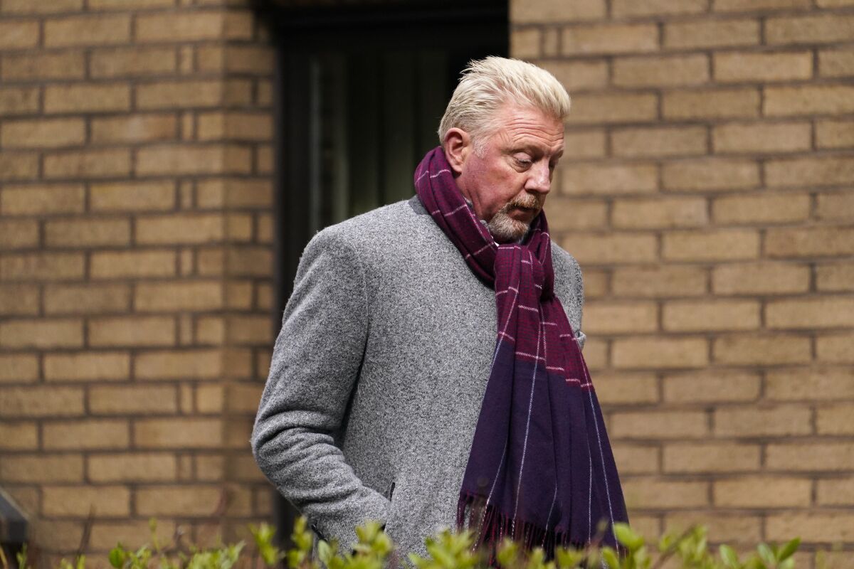 Former tennis player Boris Becker walks outside Southwark Crown Court, in London, Friday, April 8, 2022. Becker is on trial in London for allegedly concealing property — including nine trophies — from bankruptcy trustees and dodging his obligation to disclose financial information to settle his debts. (AP Photo/Alberto Pezzali)