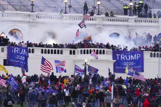 FILE - Rioters appear at the U.S. Capitol on Jan. 6, 2021, in Washington. Nathan Donald Pelham, a Texas man who shot toward sheriff's deputies making a welfare call to his house on the day he'd agreed to surrender on charges for taking part in the in the U.S. Capitol riot was sentenced to two years in prison Wednesday, Nov. 29, 2023, after pleading guilty to illegally possessing a firearm. (AP Photo/John Minchillo, File)