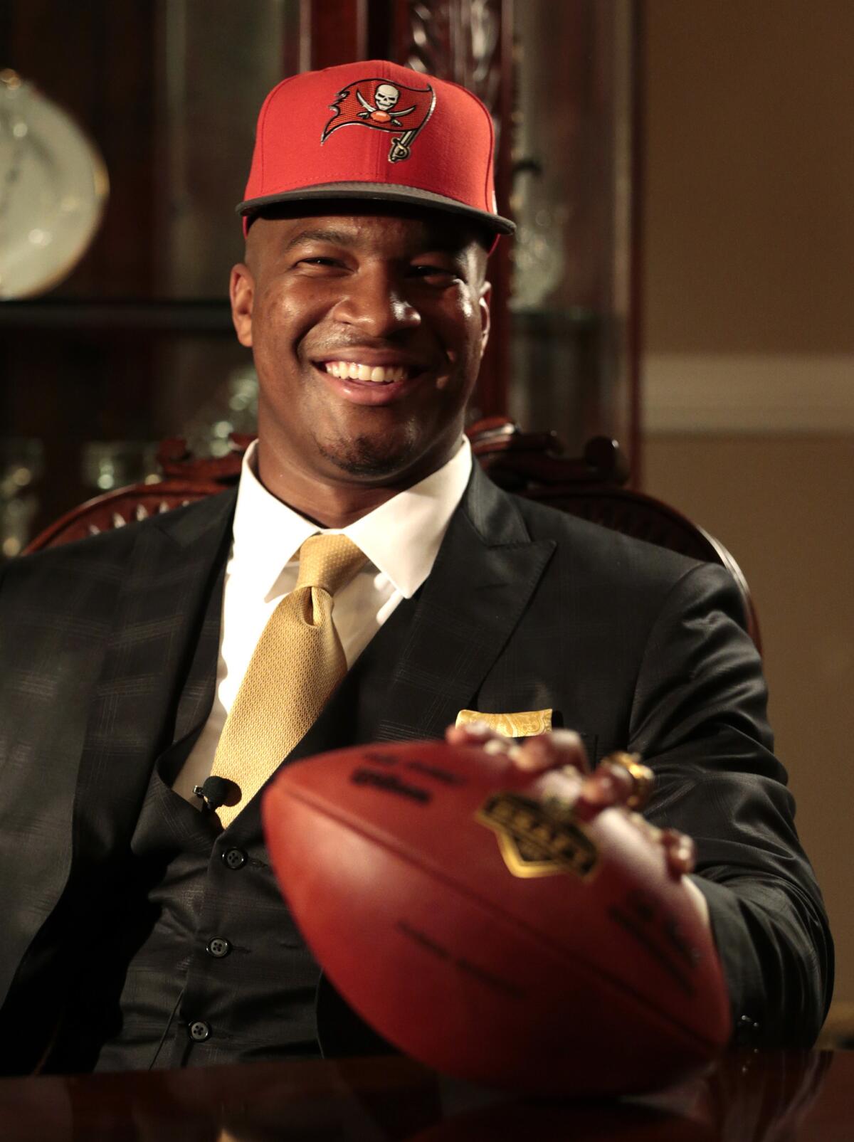 Jameis Winston wears a Buccaneers cap after being selected No. 1 overall by Tampa Bay on Thursday night.