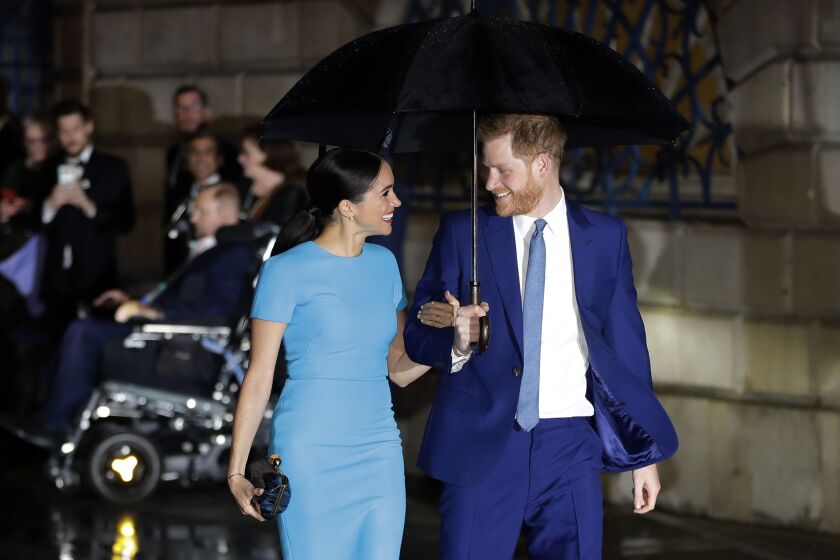 FILE - In this Thursday, March 5, 2020 file photo, Britain's Prince Harry and Meghan, the Duke and Duchess of Sussex arrive at the annual Endeavour Fund Awards in London. Harper Collins U.K. announced Monday, May 4, 2020 that it will publish “Finding Freedom: Harry and Meghan and the Making of a Modern Royal Family” in Britain and the Commonwealth on Aug. 11. The book will be published in the U.S. the same day by Dey Street Books. (AP Photo/Kirsty Wigglesworth, file)