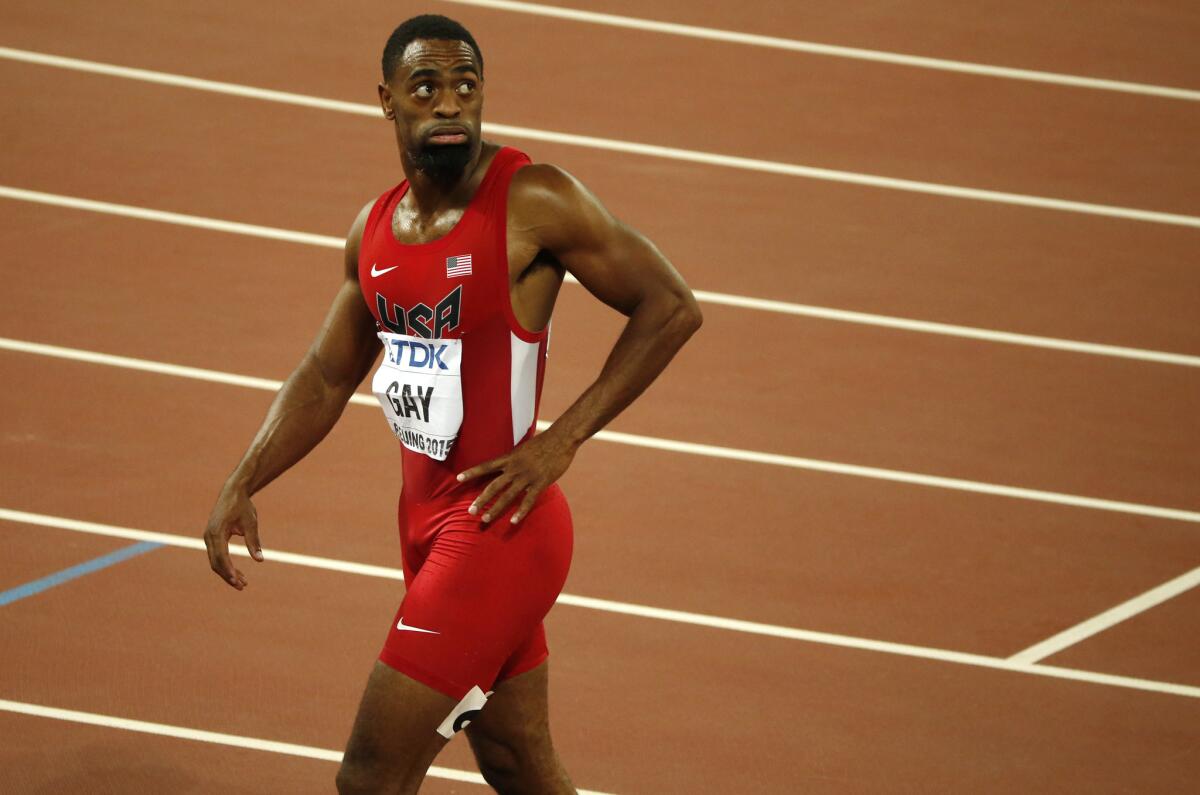 United States' Tyson Gay leaves the track after the men's 100-meter final at the World Athletics Championships at the Bird's Nest stadium in Beijing on Aug. 23, 2015.