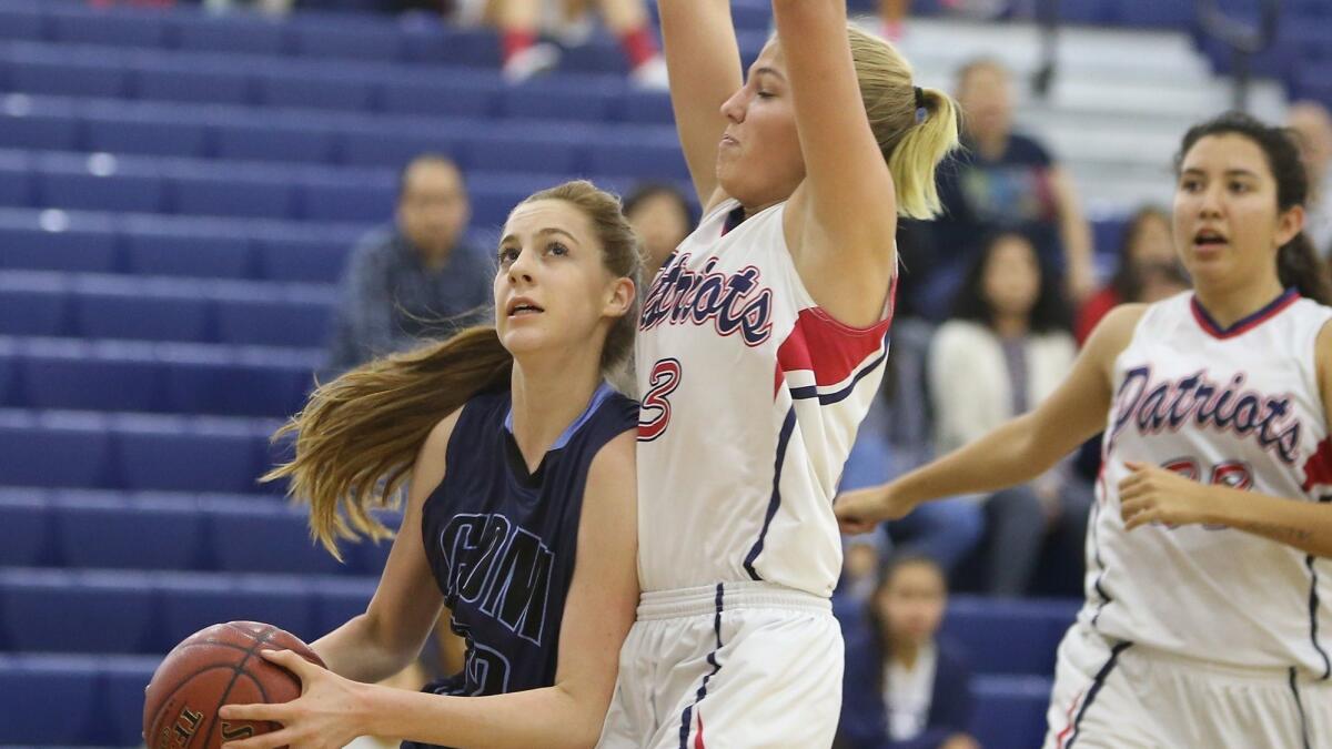 Corona del Mar High's Tatiana Bruening, shown on the left at Beckman on Jan. 26, helped the Sea Kings beat Newport Harbor 60-47 on Thursday.