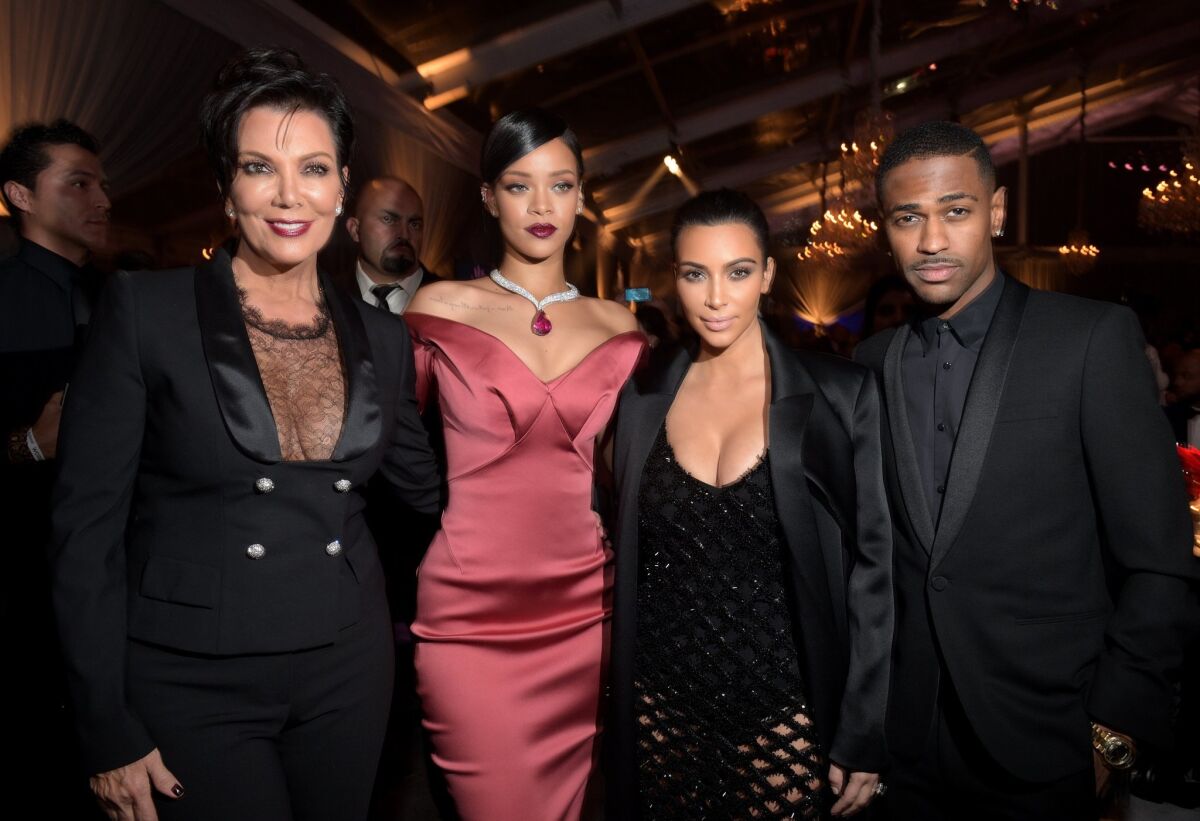 TV personality Kris Jenner, left, Rihanna, Kim Kardashian and Big Sean strike a pose at the inaugural Diamond Ball presented by Rihanna and The Clara Lionel Foundation.