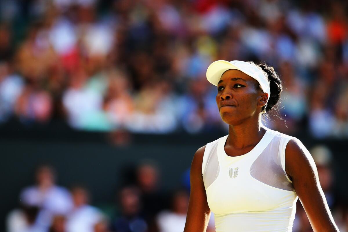 Venus Williams reacts while playing Petra Kvitova in the third round at Wimbledon on Friday.