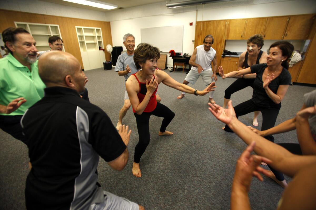 Sun-Haeng Yo, center, leads an adult class in neuromuscular intergrative action (Nia). "It's the joy of movement," she says.