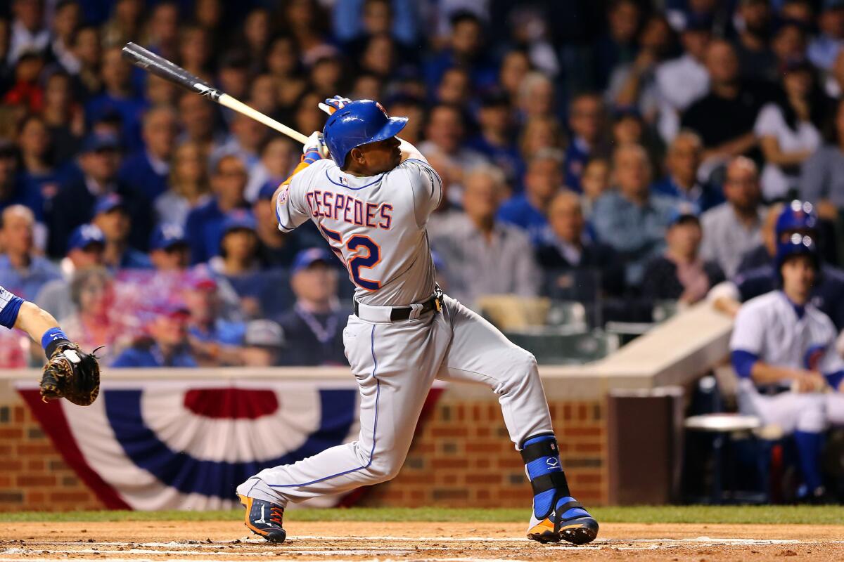 Mets slugger Yoenis Cespedes follows through on a run-scoring double against the Cubs in Game 3 of their NLDS on Oct. 20.