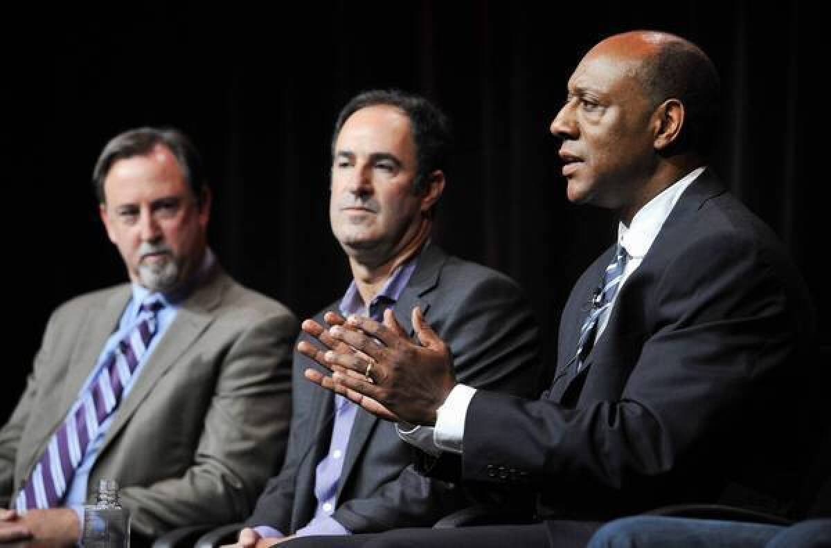 ESPN senior coordinating producer Dwayne Bray, right, and investigative reporters Mark Fainaru-Wada, left, and Steve Fainaru take part in a panel discussion on the "Frontline" documentary "League of Denial: The NFL's Concussion Crisis" during a media event this month.