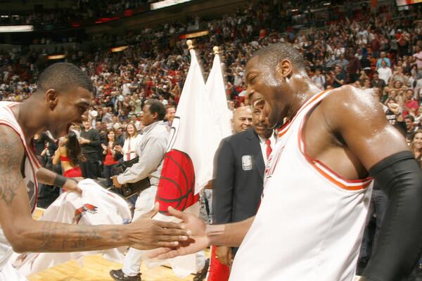 Dwyane Wade #3 and Dorell Wright #1 of the Miami Heat celebrate against the Utah Jazz