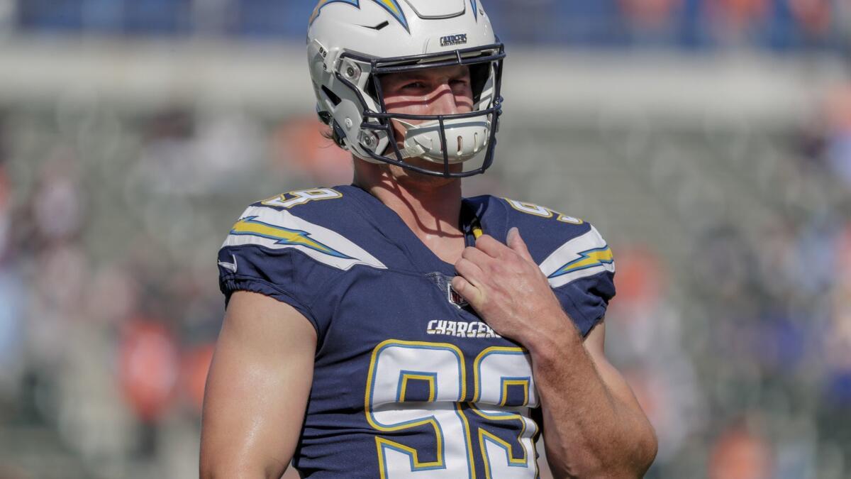 Chargers defensive lineman Joey Bosa takes the field in uniform for the first time this season during warmups before a game against the Denver Broncos at Stubhub Center on Sunday.