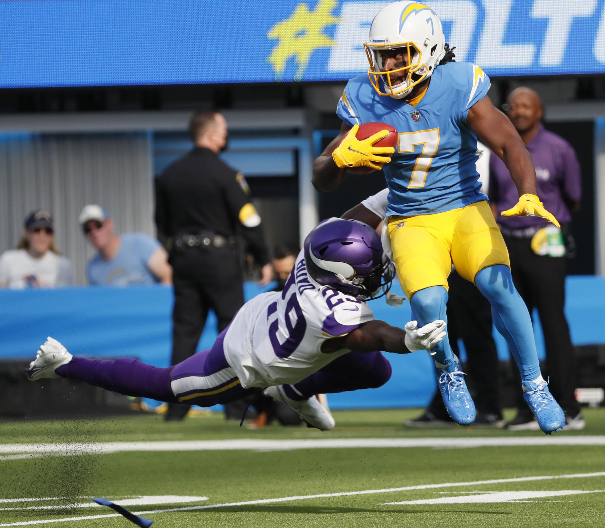 Chargers wide receiver Andre Roberts leaps to avoid the tackle of Minnesota Vikings defensive back Kris Boyd.
