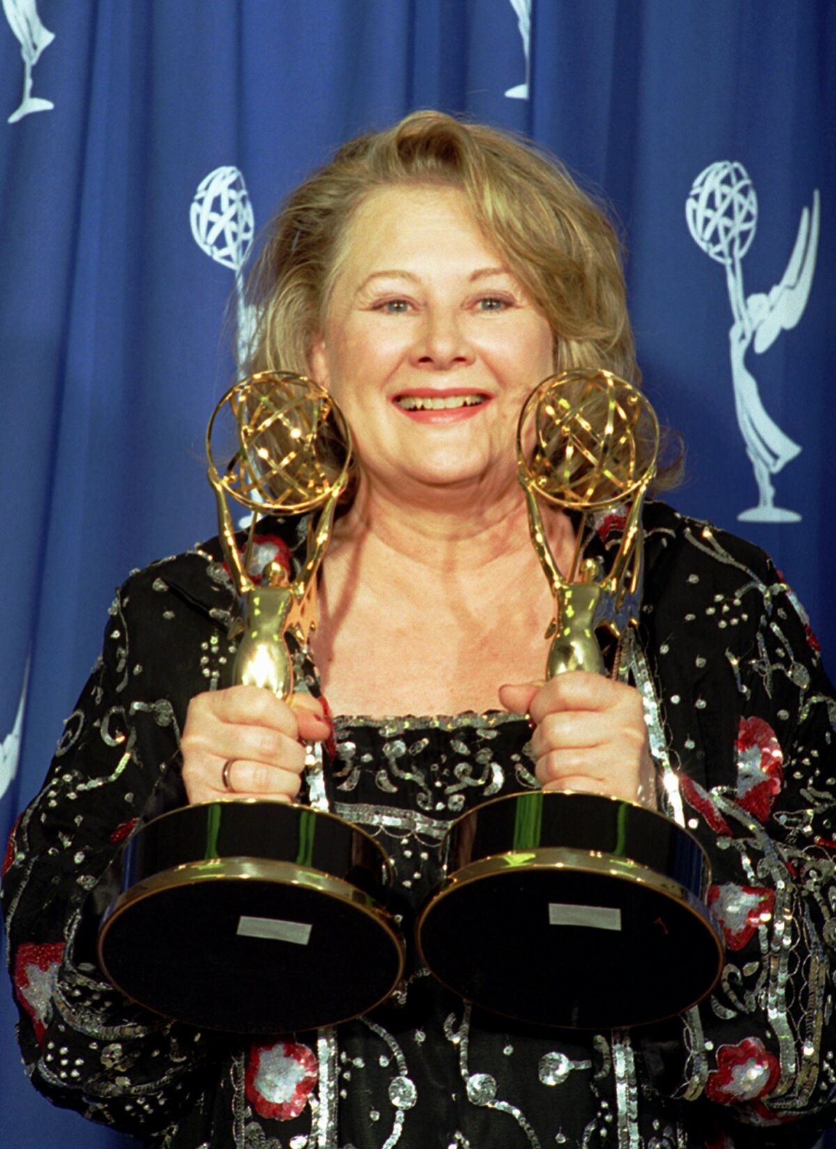 Shirley Knight holds two Emmy awards she won at the 1995 Emmy Awards at the Pasadena Civic Auditorium.
