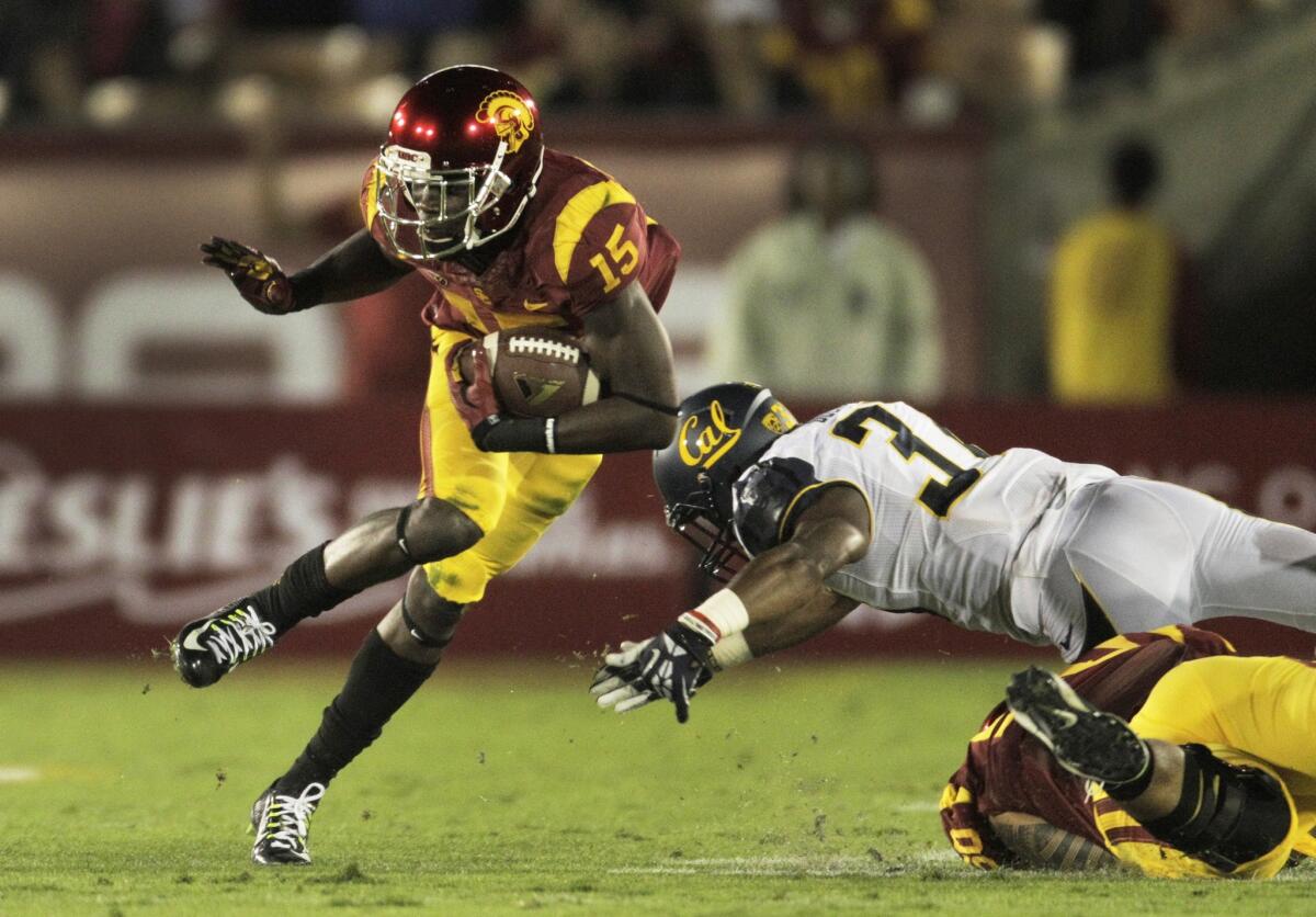 Trojans wide receiver Nelson Agholor eludes Cal cornerback Cedric Dozier in the first half.