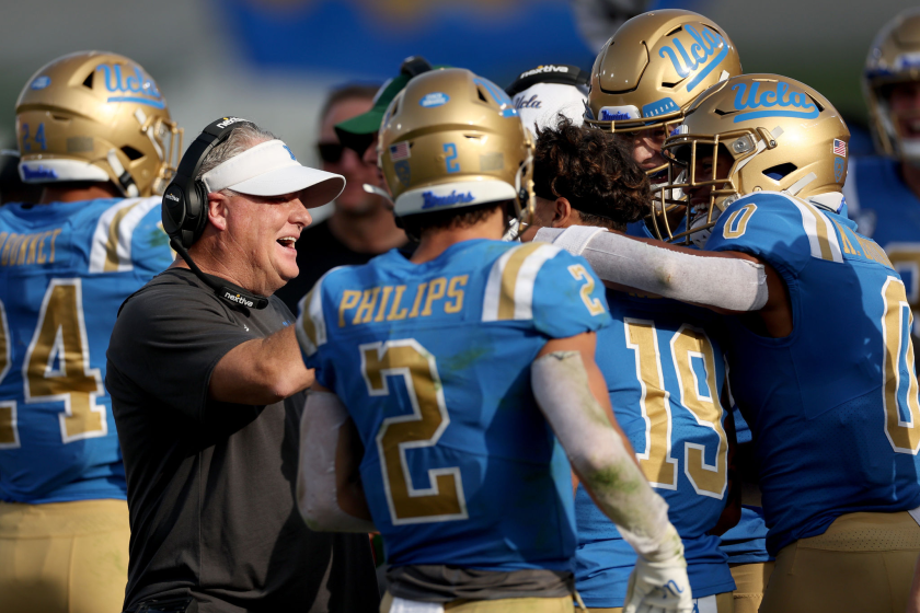 LOS ANGELES, CALIFORNIA - NOVEMBER 20: Head coach Chip Kelly of the UCLA Bruins celebrates a touchdown.
