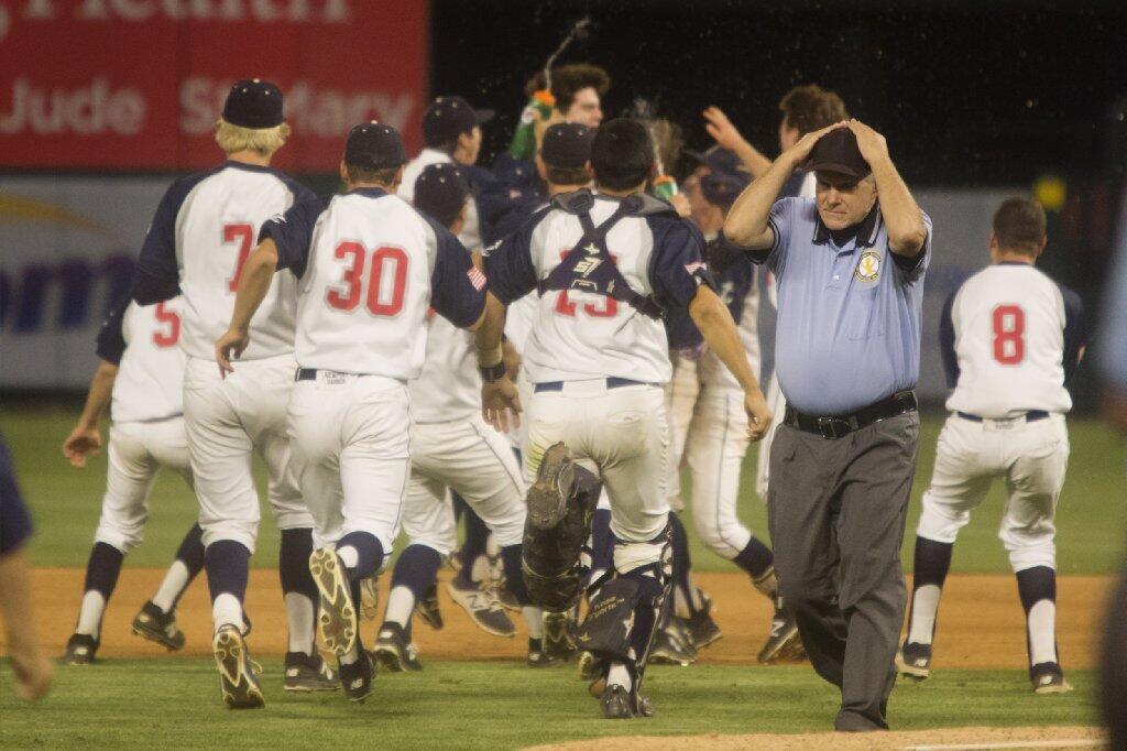 Newport Harbor celebrates after defeating Marina in a Sunset League game at Angel Stadium on Monday.