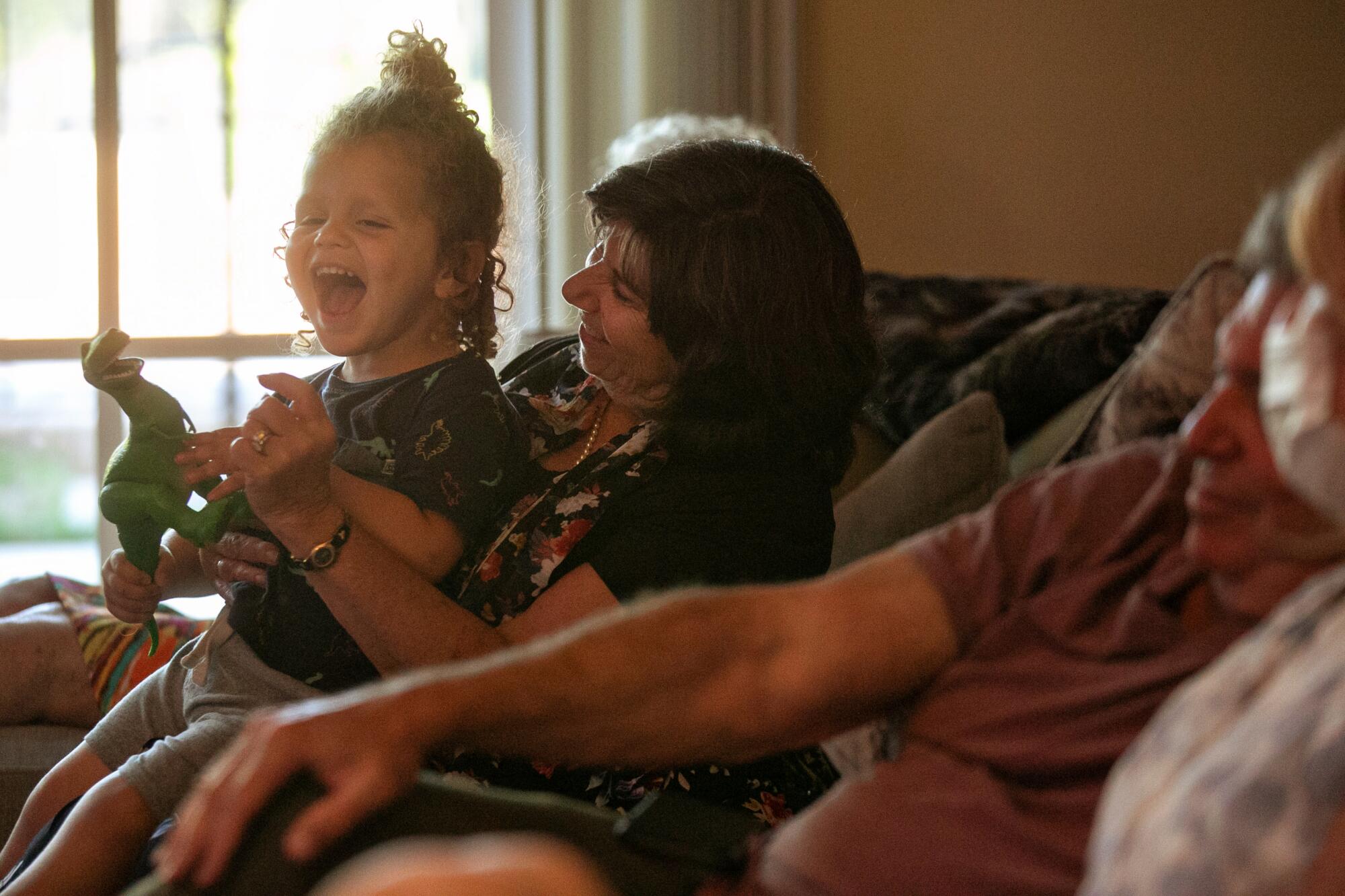 Pamela Taylor plays with her grand nephew Ari Dadon, 2, as their family celebrates Rosh Hashanah.