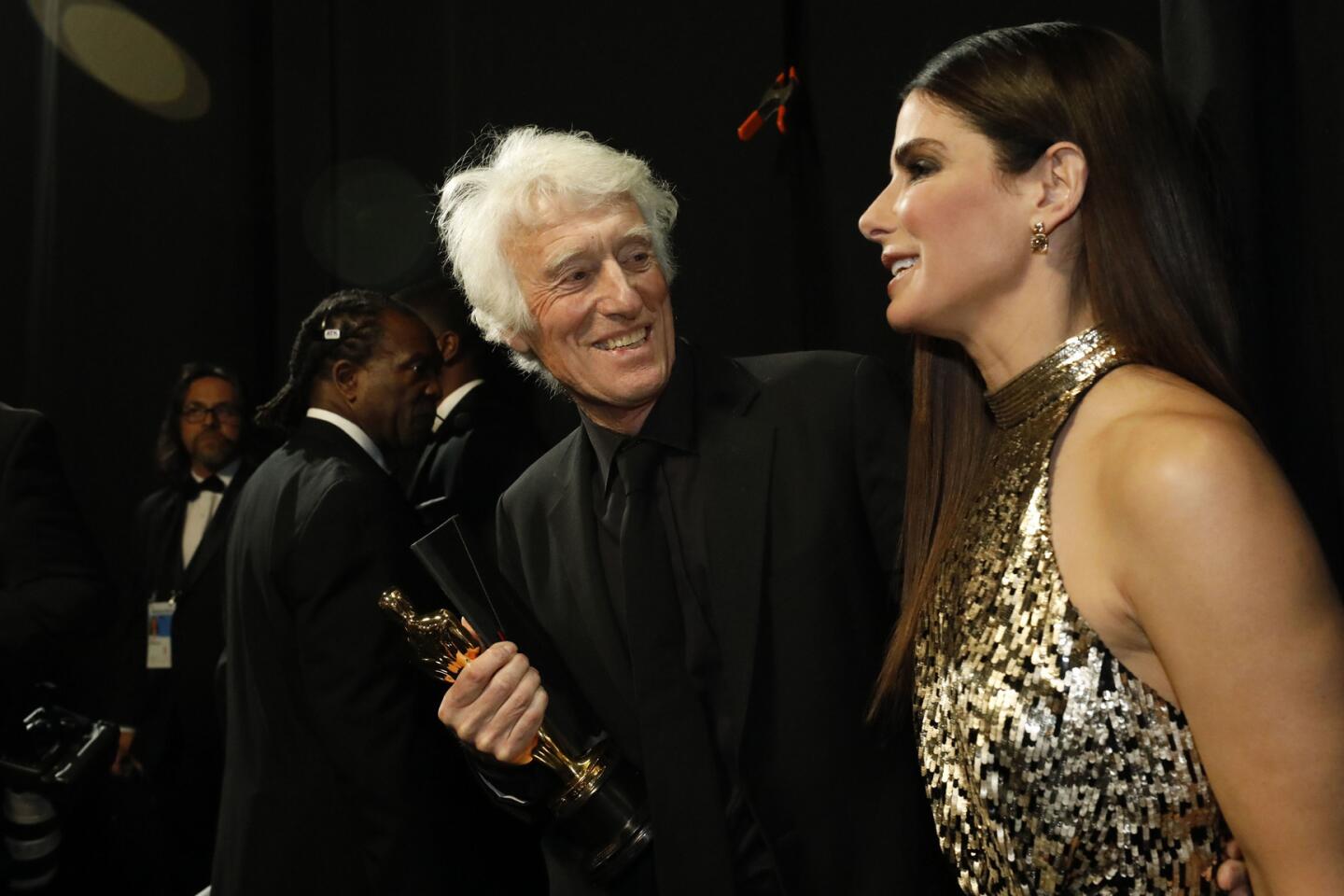 Roger Deakins, after winning for cinematography for "Blade Runner 2049," with presenter Sandra Bullock backstage at the 90th Academy Awards on Sunday at the Dolby Theatre in Hollywood.