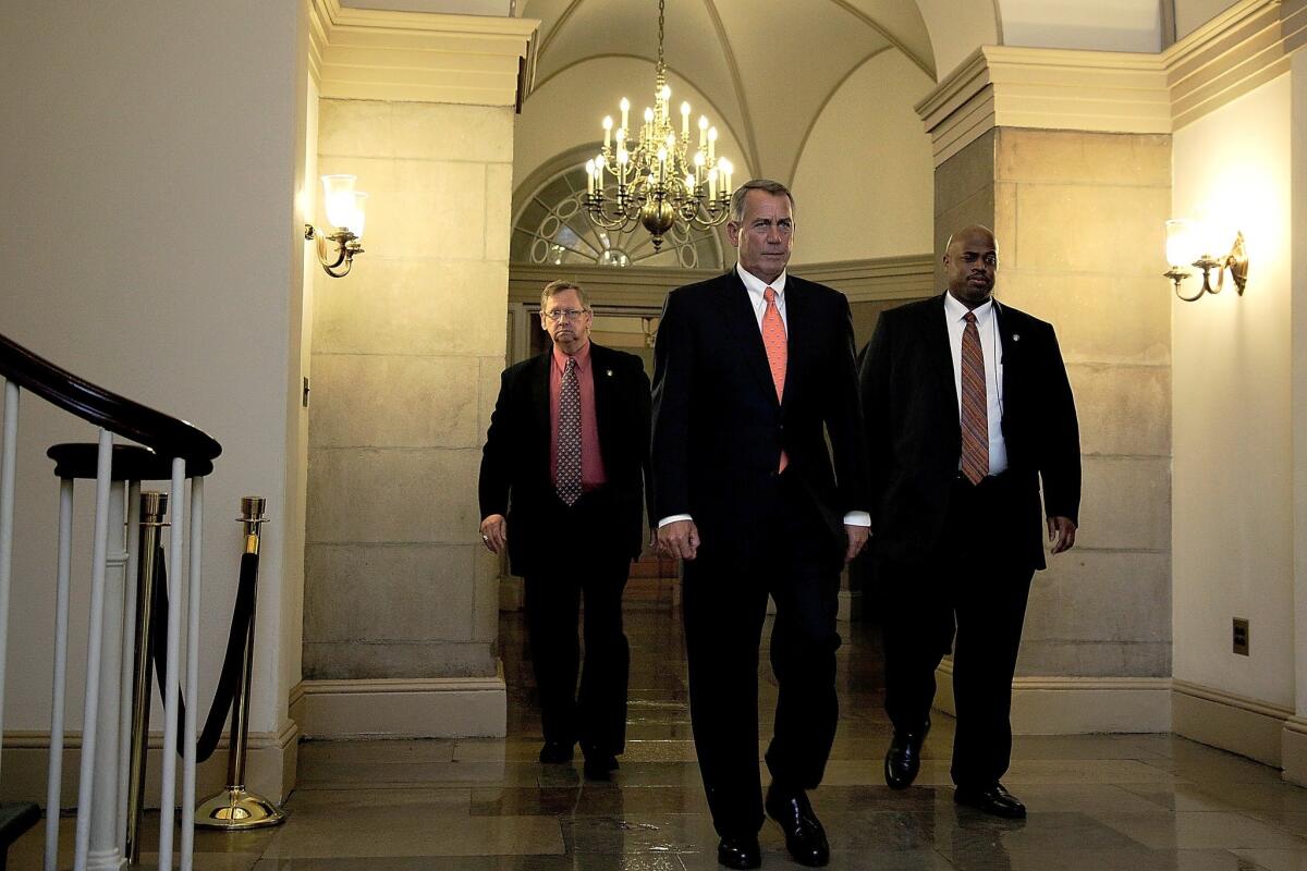 House Speaker John A. Boehner of Ohio, seen leaving the Capitol building with his security detail, and 27 other Republicans joined with House Democrats in passing legislation to suspend the borrowing limit without any policy conditions.