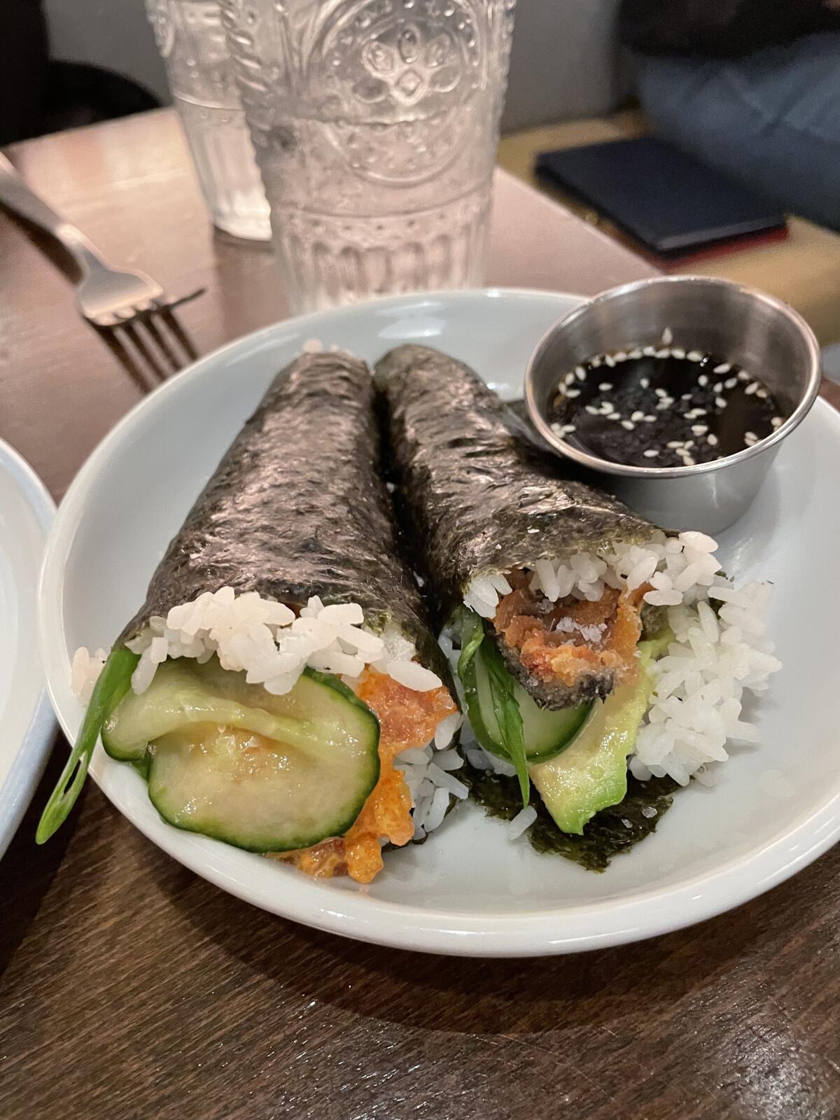 The crisp hand rolls at O SEA are fun to eat, especially the one stuffed with salmon “chicharrones.”