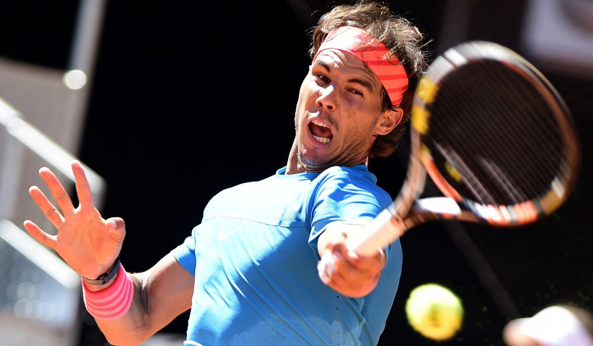 Rafael Nadal returns a shot against Simone Bolelli during a third-round match at the Madrid Open on Thursday.