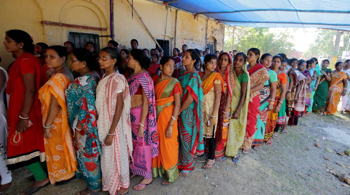 Indian citizens wait to vote in state assembly elections at Halisahar Village, West Bengal, India, on April 25. Some residents of West Bengal are voting as Indians for the first time after the resolution of a complex border dispute with neighboring Bangladesh.