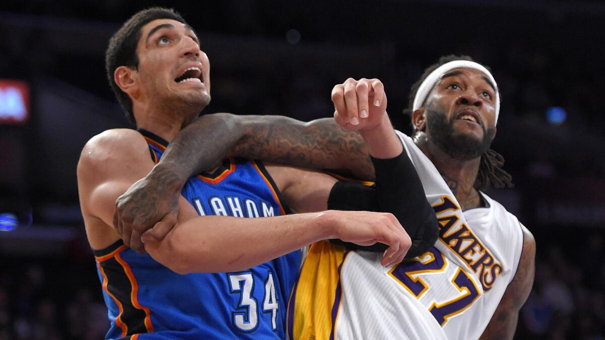Oklahoma City Thunder center Enes Kanter, left, and Lakers forward Jordan Hill battle for position under the basket during the Lakers' 108-101 loss at Staples Center on March 1.