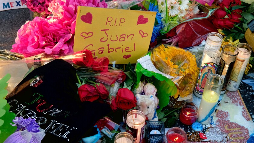 A note with flowers and candles covers a growing memorial at the Hollywood star of Mexican superstar Juan Gabriel on Aug. 29.