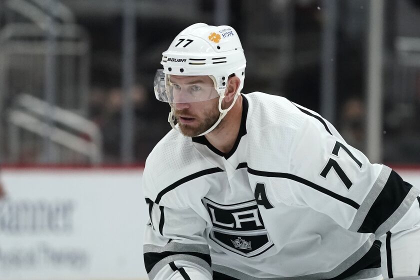 Los Angeles Kings center Jeff Carter skates to the puck during the third period of an NHL hockey game.
