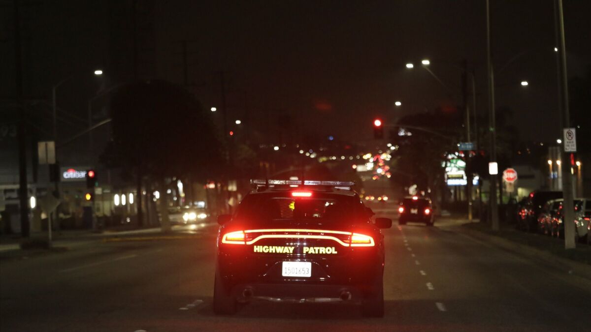 California Highway Patrol officers look for street racers in South Los Angeles.