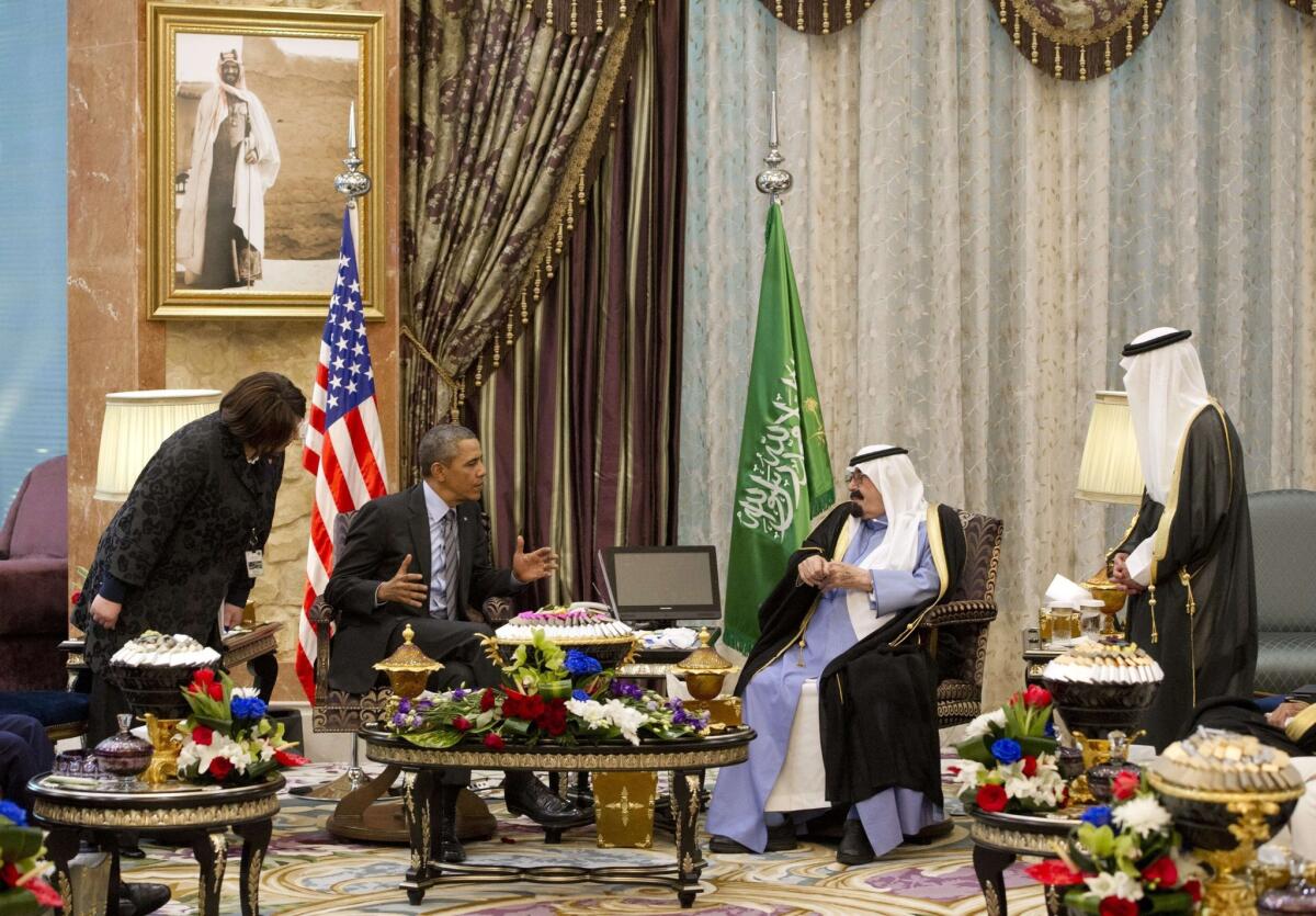 President Obama and Saudi King Abdullah meet with interpreters nearby at the monarch's desert camp northeast of Riyadh.