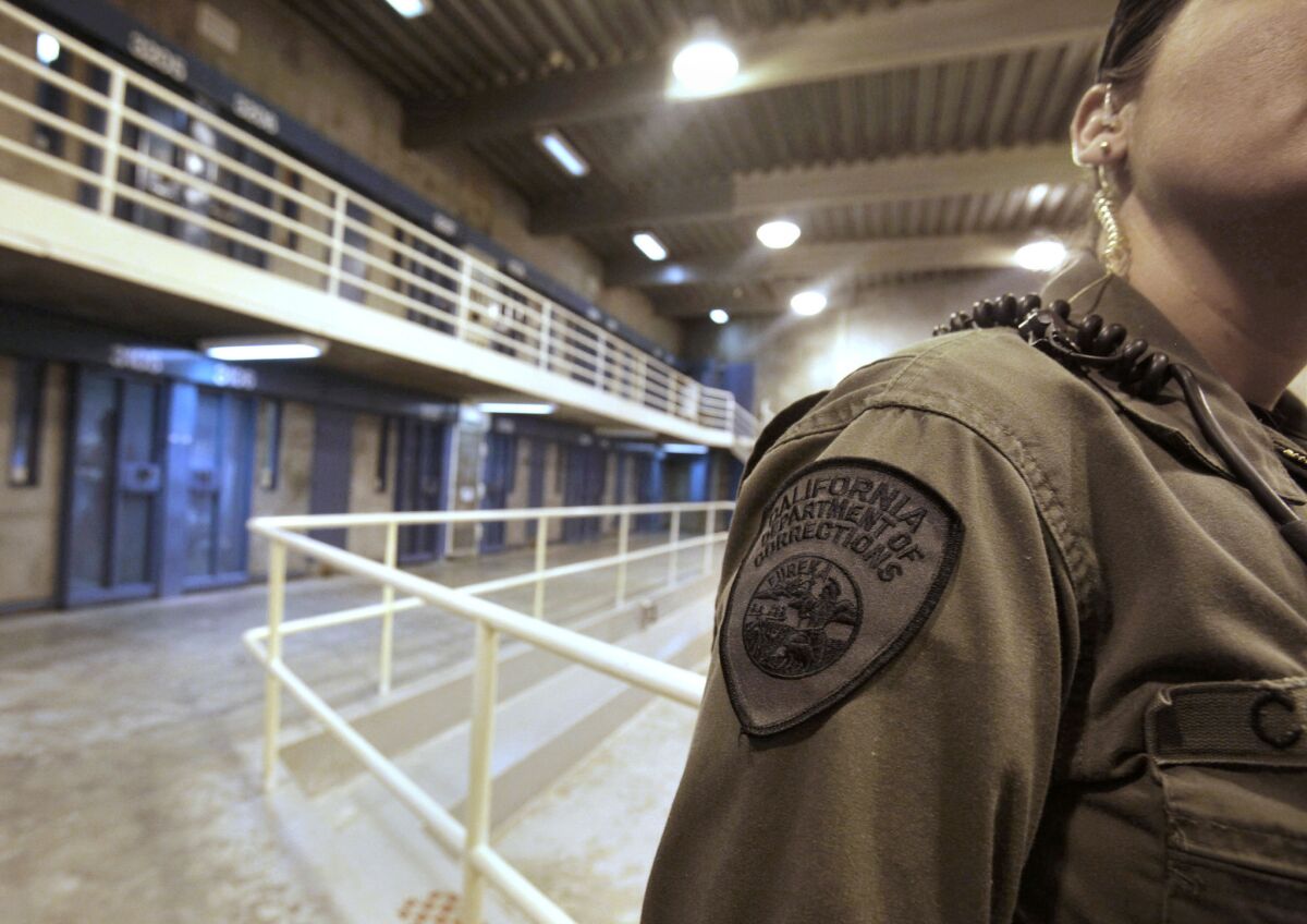 A correctional officer works at one of the housing units at Pelican Bay State Prison near Crescent City, Calif.