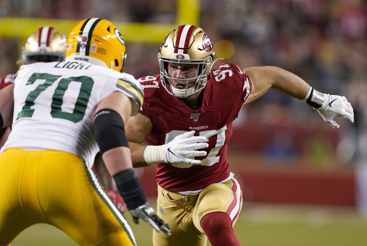 FILE - In this Nov. 24, 2019, file photo, San Francisco 49ers defensive end Nick Bosa (97) rushes against Green Bay Packers offensive guard Alex Light (70) during the first half of an NFL football game in Santa Clara, Calif. After nearly a year-long wait, the Niners can't wait to see Bosa's dominance in a game when he returns from a knee injury in the season opener at Detroit on Sunday. He’s a game wrecker,” linebacker Fred Warner said. “He’s one of those guys that has that ability.” (AP Photo/Tony Avelar, File)
