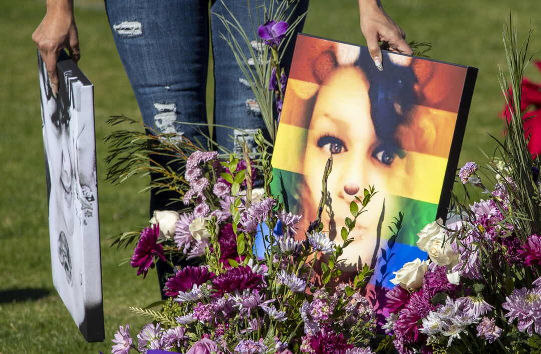 'Like a thief in the night:' How COVID-19 rampaged through
one family 2 Getty Alvarado gathers photos of Tatyana Cantu Broughton following a memorial service at Desert Memorial Park.