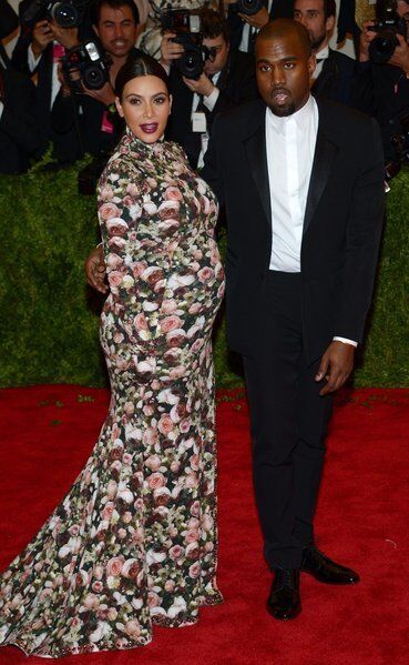 Kim Kardashian and Kanye West. Kardashian is wearing a Riccardo Tisci dress and gloves with Lorraine Schwartz jewelry.