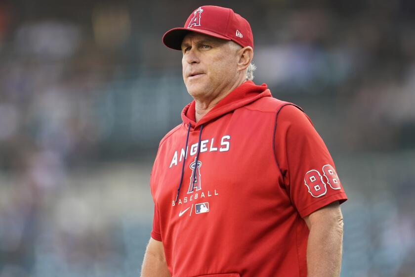 Los Angeles Angels interim manager Phil Nevin watches against the Detroit Tigers