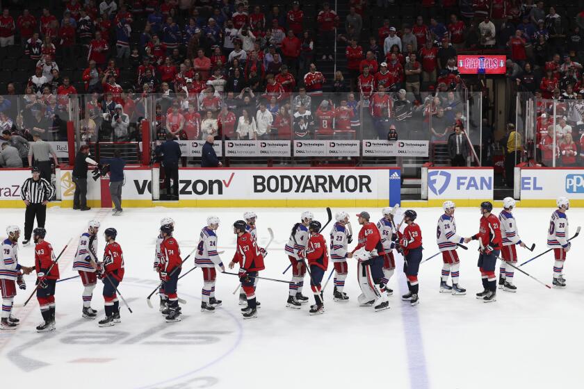 New York Rangers players shake hands after defeating the Washington Capitals in Game 4 of an NHL hockey Stanley Cup first-round playoff series, Sunday, April 28, 2024, in Washington. (AP Photo/Tom Brenner)