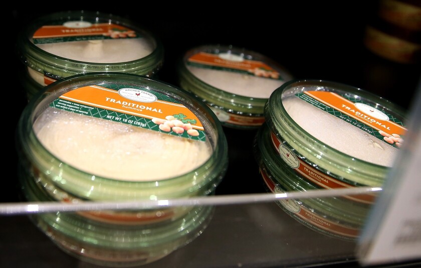 Nearly 15,000 pounds of hummus made by Massachusetts-based Hot Mama's Foods and sold at Target and Trader Joe's have been recalled due to possible listeria contamination, including some packages of Archer Farms traditional hummus, above.